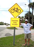 Jake Sachs, candidate for a New Smyrna Beach commissioner seat stands on Third Aveveue, where he got speeds lowered / Headline Surfer®