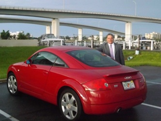 Henry Frederick and his red Audi TT in Daytona Beach / Headline Surfer